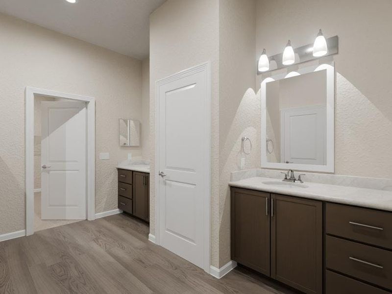 Your suite is complete with a spacious en-suite bath with dual vanities, each including counter space and a drawer stack. (Artist`s rendering)