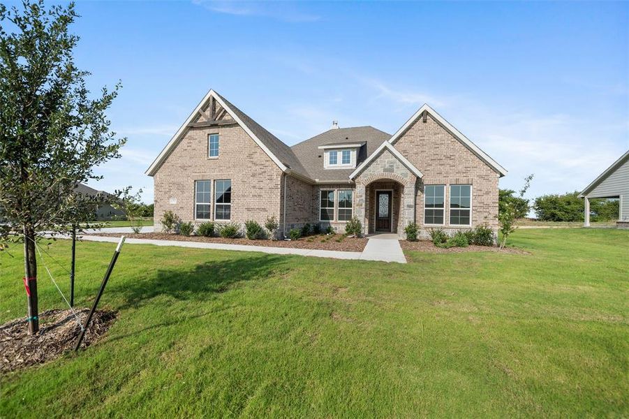 Front exterior of a new home in Fairview Meadows, New Fairview, TX, highlighting curb appeal (Image 20). Front exterior of a new home in Fairview Meadows, New Fairview, TX, highlighting curb appeal (Image 20).
