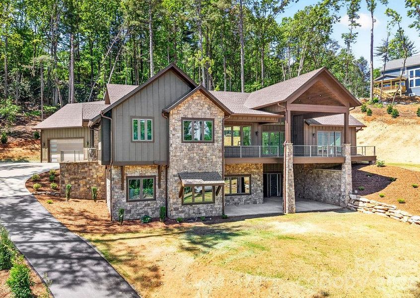 Front exterior of a new home in , Hendersonville, NC, highlighting curb appeal (Image 2). Front exterior of a new home in , Hendersonville, NC, highlighting curb appeal (Image 2).