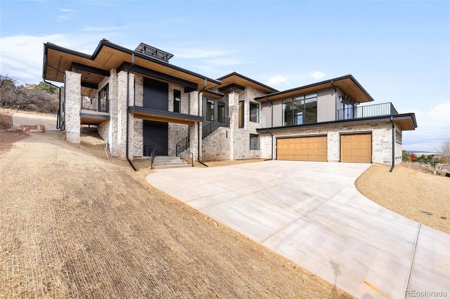 Front exterior of a new home in , Littleton, CO, highlighting curb appeal (Image 18).