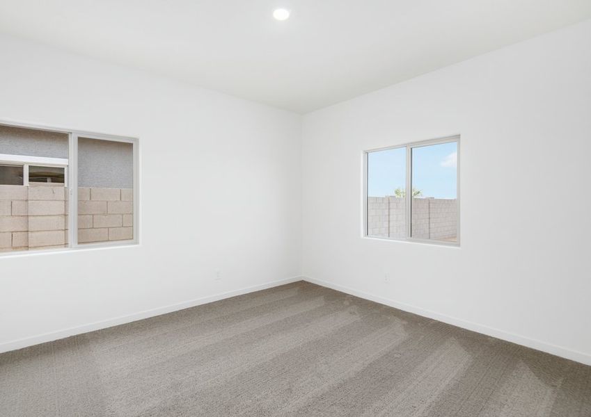 Each bedroom is filled with natural lighting from large windows.