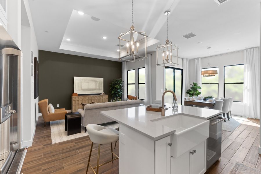Kitchen with pendant lighting overlooking great room Kitchen with pendant lighting overlooking great room