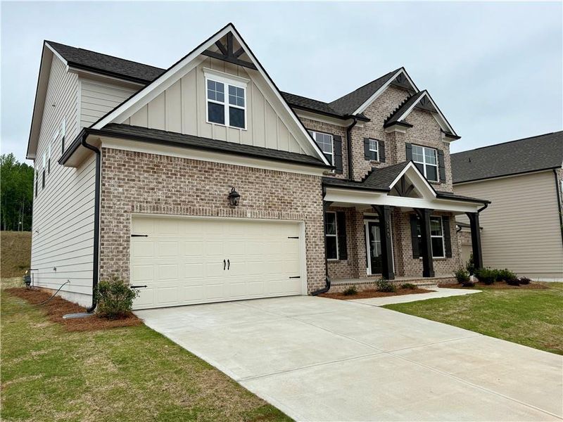 Front exterior of a new home in Ponderosa Farms Manor, Gainesville, GA, highlighting curb appeal (Image 21).