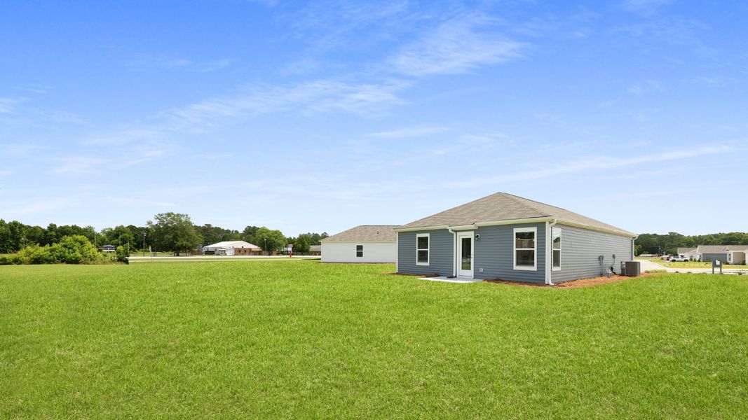 Front exterior of a new home in Evergreen, Holly Hill, SC, highlighting curb appeal (Image 17).