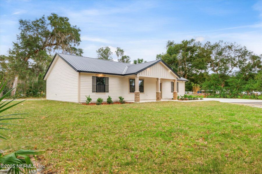 Front exterior of a new home in , San Mateo, FL, highlighting curb appeal (Image 37). Front exterior of a new home in , San Mateo, FL, highlighting curb appeal (Image 37).