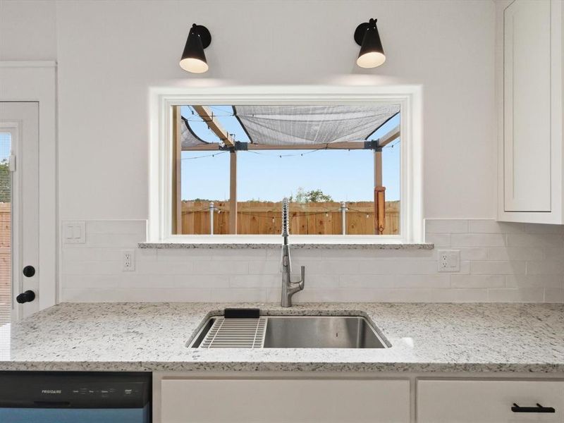 Natural light floods into this kitchen with the oversized window above the sink!
