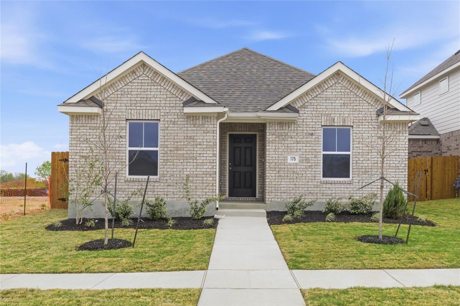 Front exterior of a new home in Infinity Square, Kyle, TX, highlighting curb appeal (Image 17).