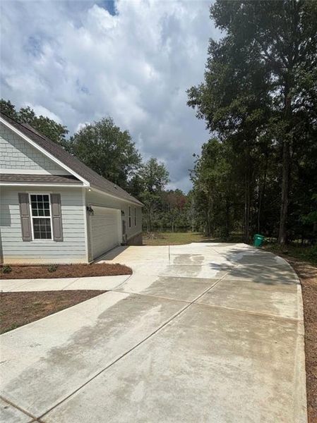 Front exterior of a new home in , Milledgeville, GA, highlighting curb appeal (Image 21).