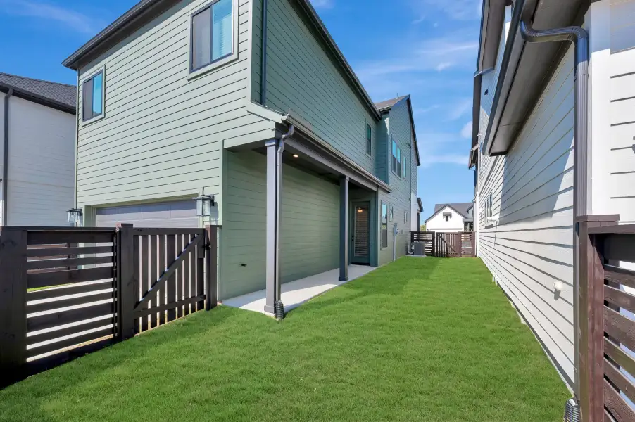 Exterior details and patio area of a home in Bridgeland Central: Emerald Heights - Cottages Row Collection, Cypress (Image 3). Exterior details and patio area of a home in Bridgeland Central: Emerald Heights - Cottages Row Collection, Cypress (Image 3).