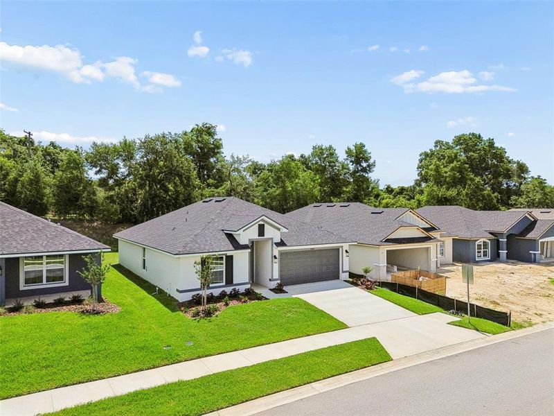 Front exterior of a new home in Abbey Glen, Dade City, FL, highlighting curb appeal (Image 32). Front exterior of a new home in Abbey Glen, Dade City, FL, highlighting curb appeal (Image 32).