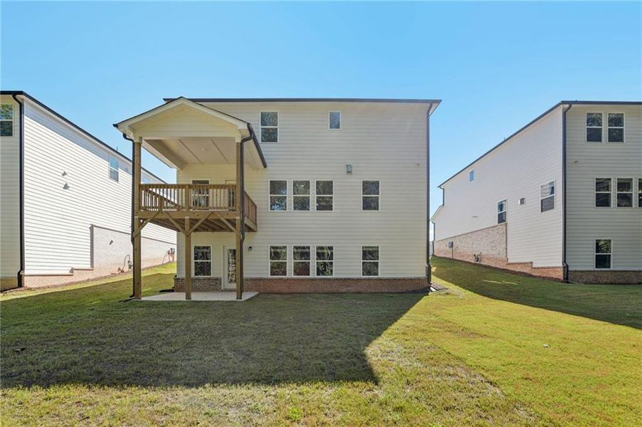 Front exterior of a new home in Martin Springs - Estate Series, Lawrenceville, GA, highlighting curb appeal (Image 25). Front exterior of a new home in Martin Springs - Estate Series, Lawrenceville, GA, highlighting curb appeal (Image 25).