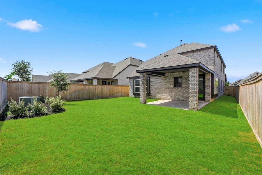 Exterior details and patio area of a home in Bridgeland, Cypress (Image 21).