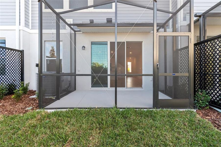 Exterior details and patio area of a home in North River Ranch – Townhomes, Parrish (Image 24).