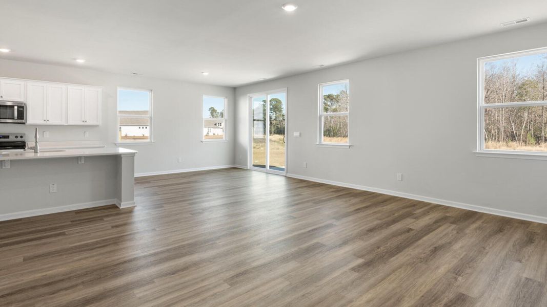 Representative unfurnished interior of a home built from the HARBOR OAK by D.R. Horton in Indigo Preserve, Leland (Image 30).