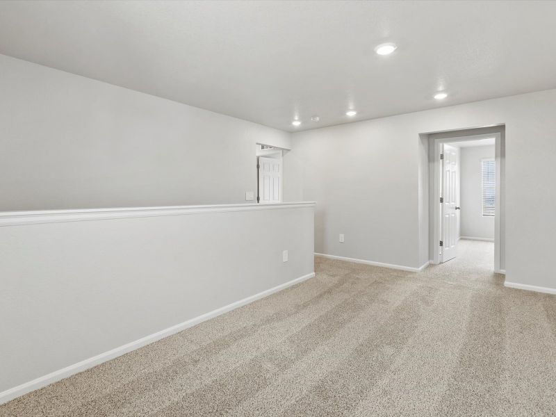 Spacious, unfurnished interior of a new home in Frontier Estates - The Flora Collection, Firestone (Image 10).