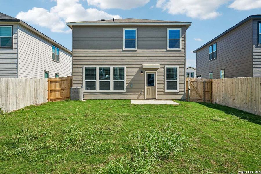 Exterior details and patio area of a home in Medina Crossing, Von Ormy (Image 17).