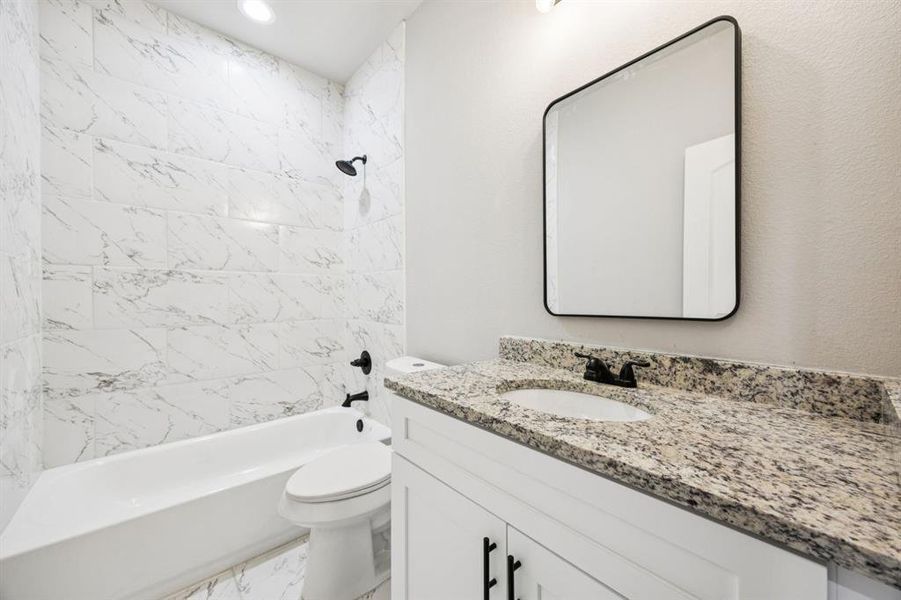 Hallway Bathroom featuring shower / bath combination, granite countertop vanity, and recessed lighting Hallway Bathroom featuring shower / bath combination, granite countertop vanity, and recessed lighting
