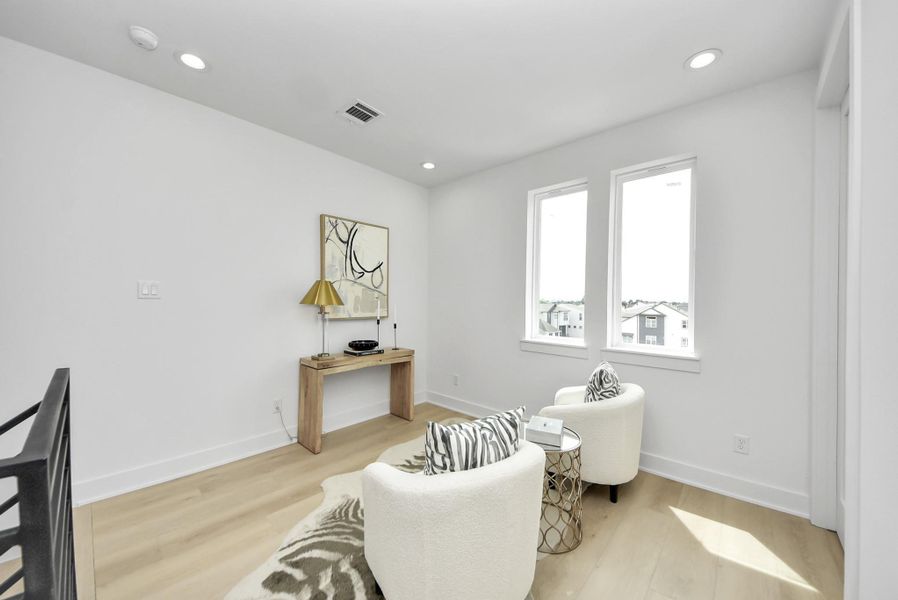 Fourth-floor sitting area filled with natural light.