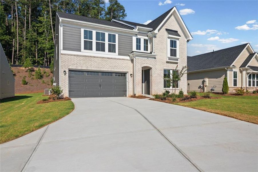 Front exterior of a new home in Easton Park, Dallas, GA, highlighting curb appeal (Image 18).