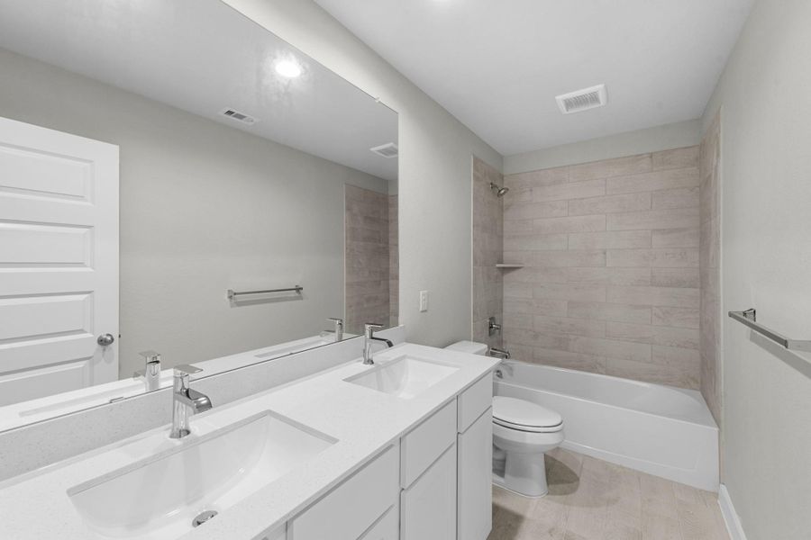 Furnished interior view inside a new home in Barton Creek Ranch, Conroe (Image 11).