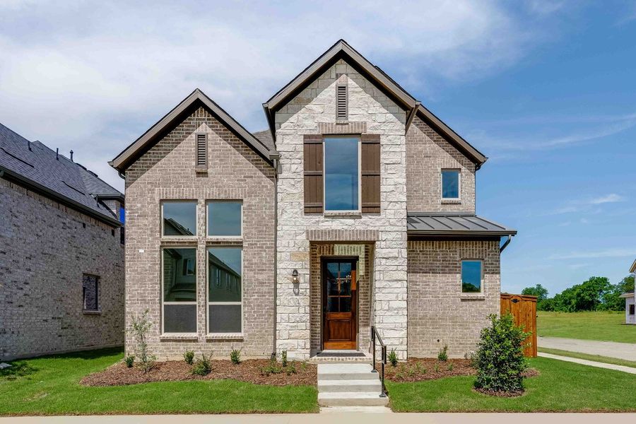 Representative exterior photo of a completed home built from the Lanier by Taylor Morrison in The Ranch at Uptown Celina 40s, Celina, TX (Image 1). Representative exterior photo of a completed home built from the Lanier by Taylor Morrison in The Ranch at Uptown Celina 40s, Celina, TX (Image 1).