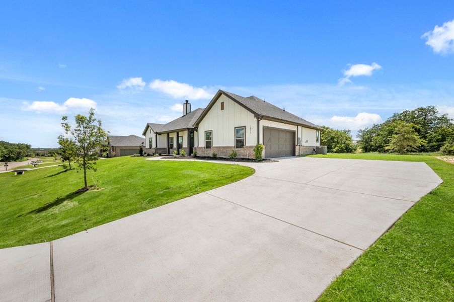 Front exterior of a new home in Saddleback Estates, Boyd, TX, highlighting curb appeal (Image 18).