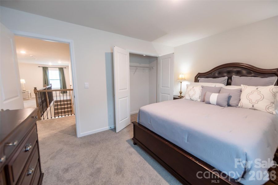 Upper-level bedroom with ample closet space.