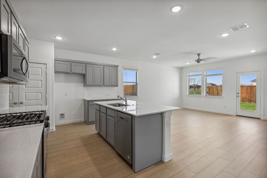 Kitchen in the Oak II home plan by Trophy Signature Homes – REPRESENTATIVE PHOTO