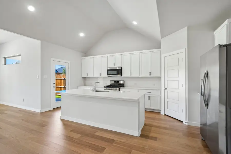 Kitchen in the Wimbledon home plan by Trophy Signature Homes