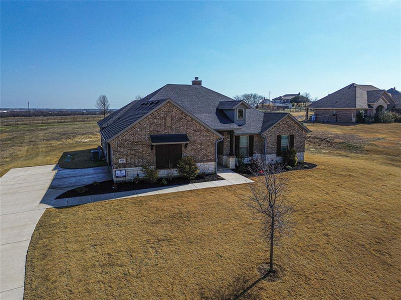 View of front of property featuring a front yard