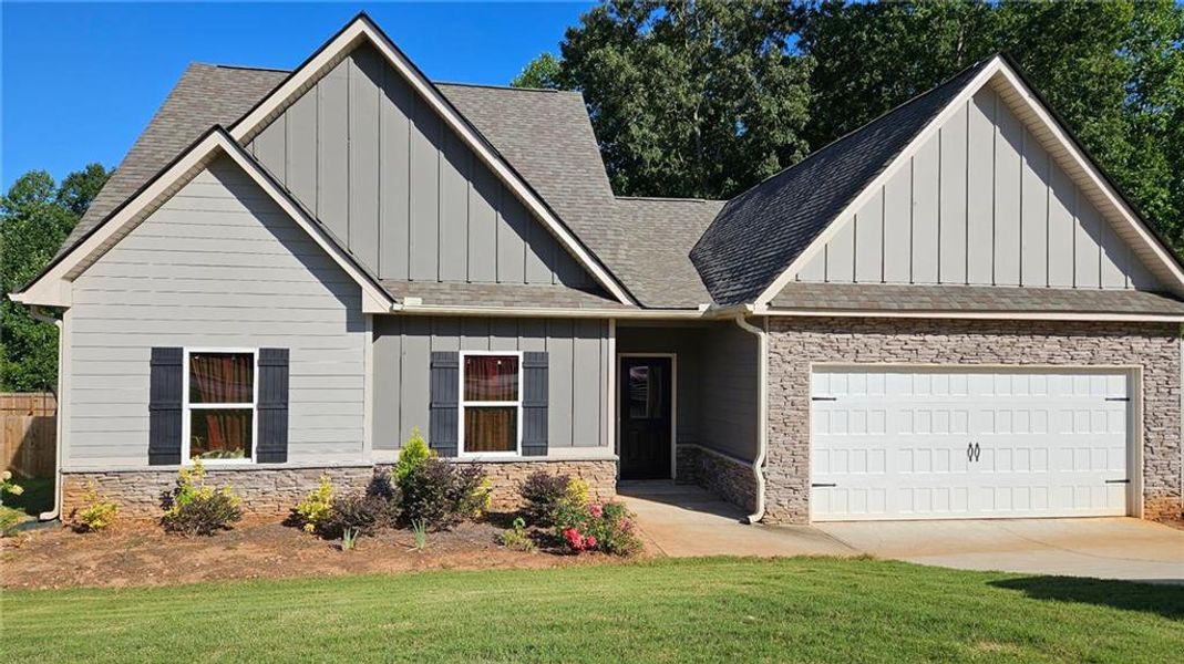 Front exterior of a new home in , Statham, GA, highlighting curb appeal (Image 21).