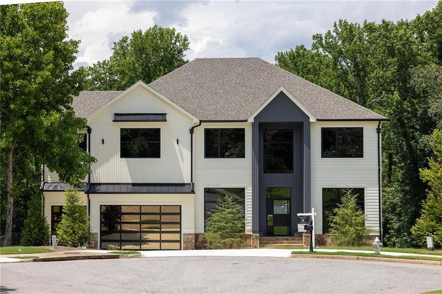 Front exterior of a new home in , Milton, GA, highlighting curb appeal (Image 1). Front exterior of a new home in , Milton, GA, highlighting curb appeal (Image 1).