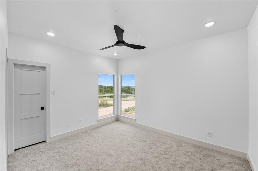 Carpeted empty room featuring recessed lighting and ceiling fan Carpeted empty room featuring recessed lighting and ceiling fan