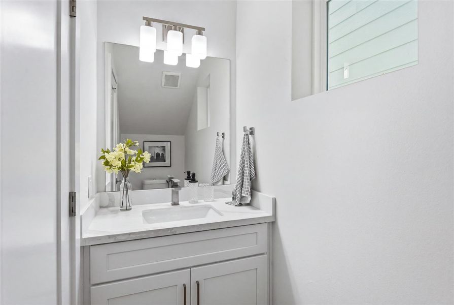 Convenient half bath on the main level. Convenient half bath on the main level.