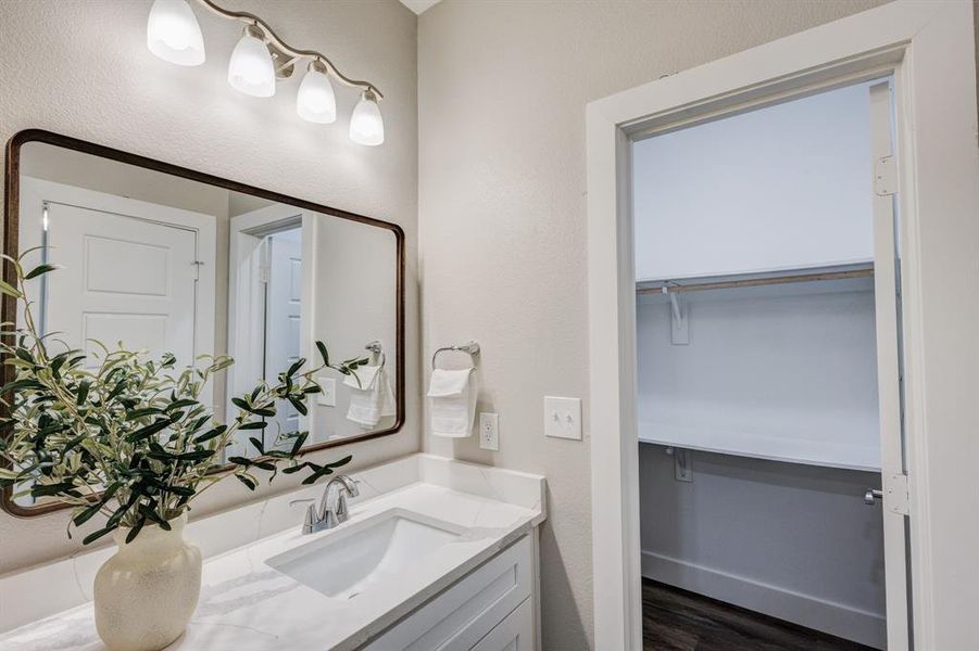 Bathroom with vanity and hardwood / wood-style flooring