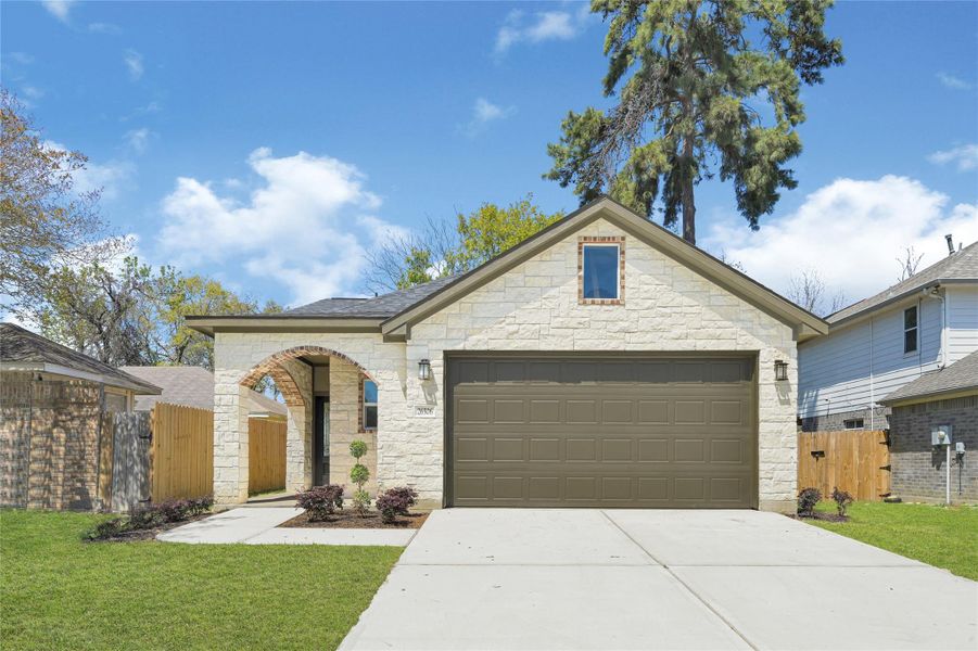 Front exterior of a new home in , Spring, TX, highlighting curb appeal (Image 2). Front exterior of a new home in , Spring, TX, highlighting curb appeal (Image 2).