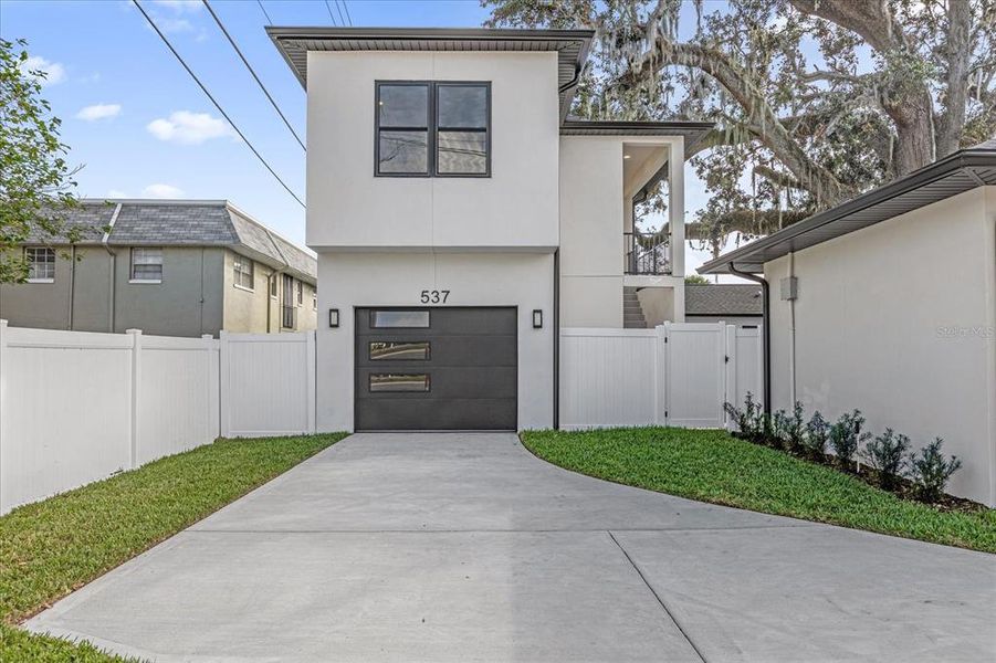 Front exterior of a new home in , Orlando, FL, highlighting curb appeal (Image 2).