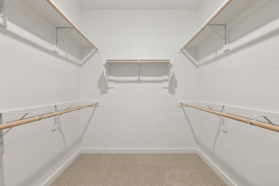 Primary Closet in the Masters home plan by Trophy Signature Homes – REPRESENTATIVE PHOTO