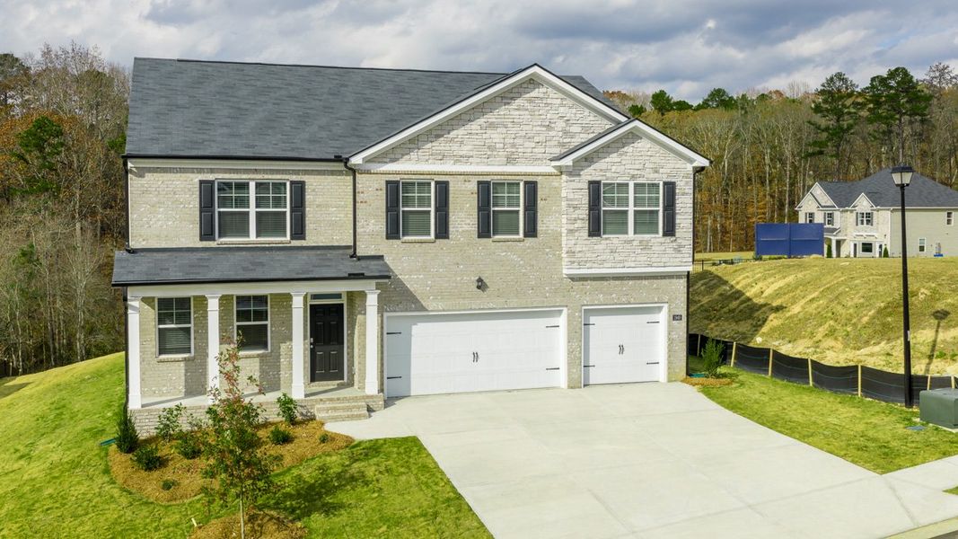 Front exterior of a new home in Brooks Station, Dacula, GA, highlighting curb appeal (Image 2). Front exterior of a new home in Brooks Station, Dacula, GA, highlighting curb appeal (Image 2).