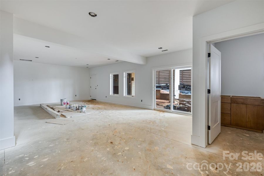 Basement (with full bath, access to garage and back storage room and to the outside carport)