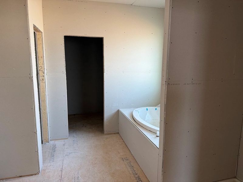 Primary Bath featuring the AW Collection® Sapphire - Clean white and cool hues define the space.