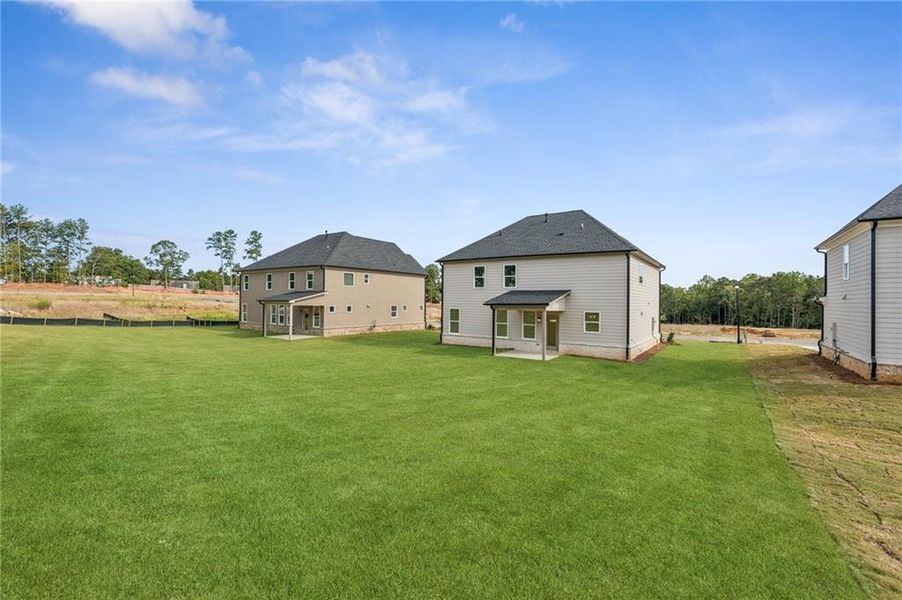 Front exterior of a new home in , Lawrenceville, GA, highlighting curb appeal (Image 22).