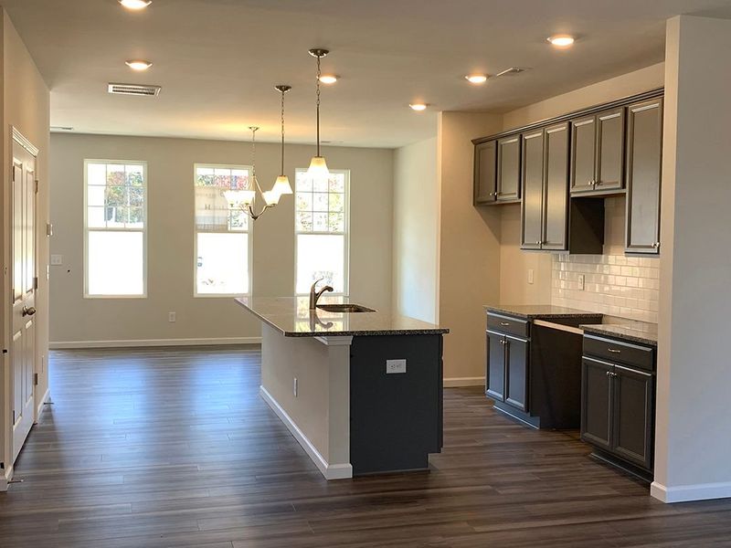 Great room looking towards kitchen and dining room