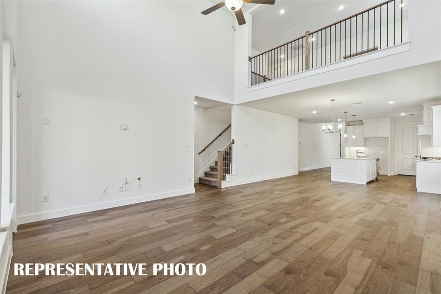 The game room features open railing overlooking the family room creating a multi-story entertaining space!  REPRESENTATIVE PHOTO