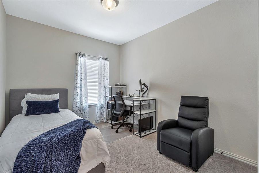 Bedroom featuring carpet floors