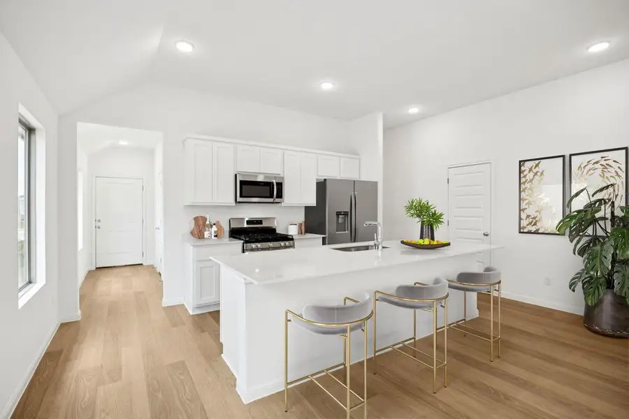 Kitchen in the Spruce home plan by Trophy Signature Homes - REPRESENTATIVE PHOTO