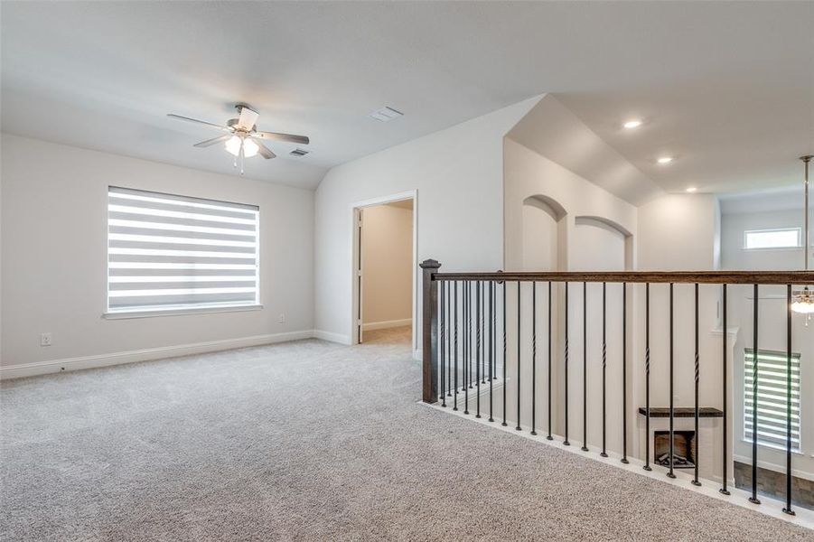 Unfurnished room with ceiling fan, carpet floors, baseboards, recessed lighting, and vaulted ceiling