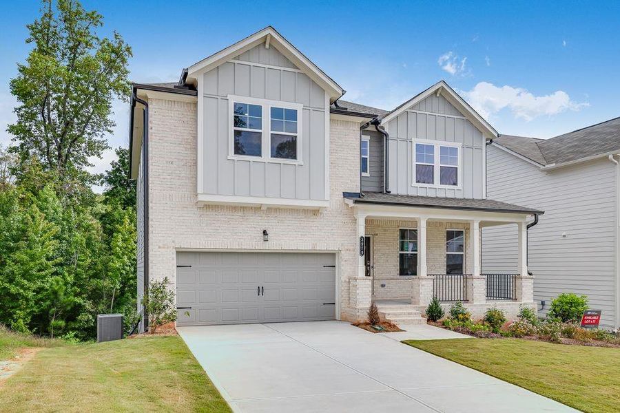 Front exterior of a new home in Falls Creek, Flowery Branch, GA, highlighting curb appeal (Image 22).