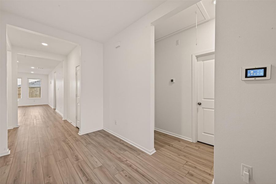 Welcoming entry with upgraded flooring (not from the builder) and a bright, open feel that sets the tone for the rest of the home.