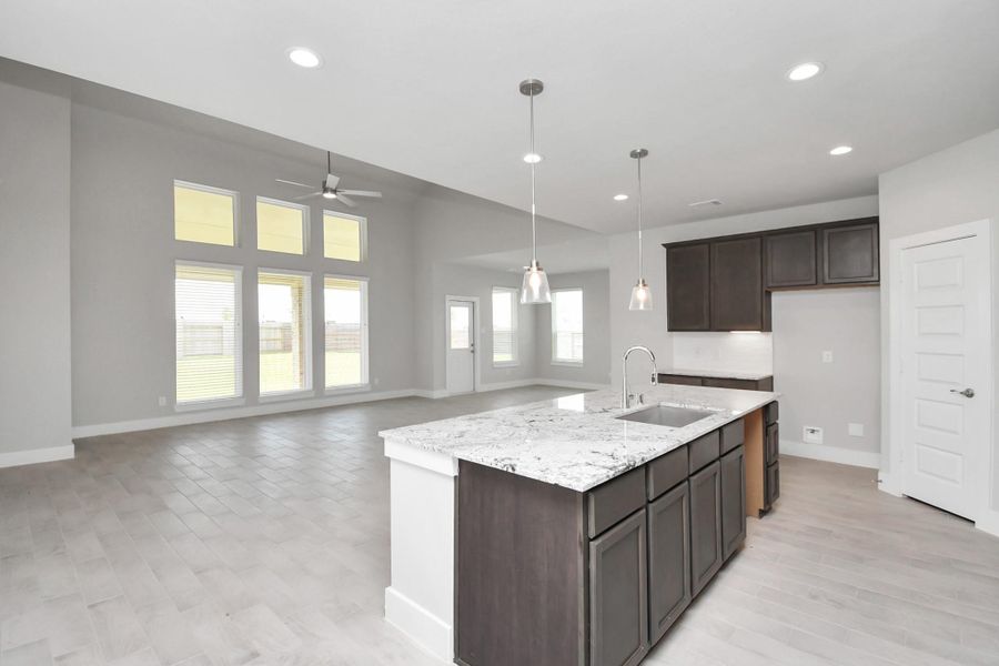 This generously spacious kitchen is a dream realized! Sample photo of completed home with similar floor plan. Actual colors and selections may vary. This generously spacious kitchen is a dream realized! Sample photo of completed home with similar floor plan. Actual colors and selections may vary.